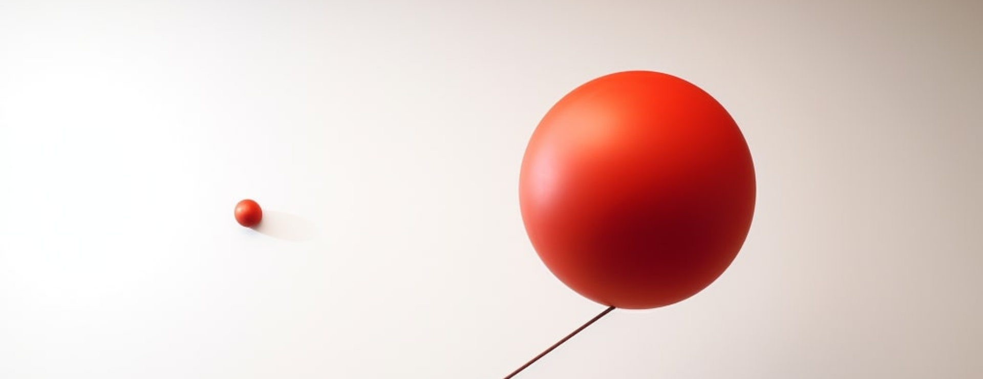 "Kinetic sculpture, 'Whispering,' presents a motor-driven red ball within a rotating steel mechanism
