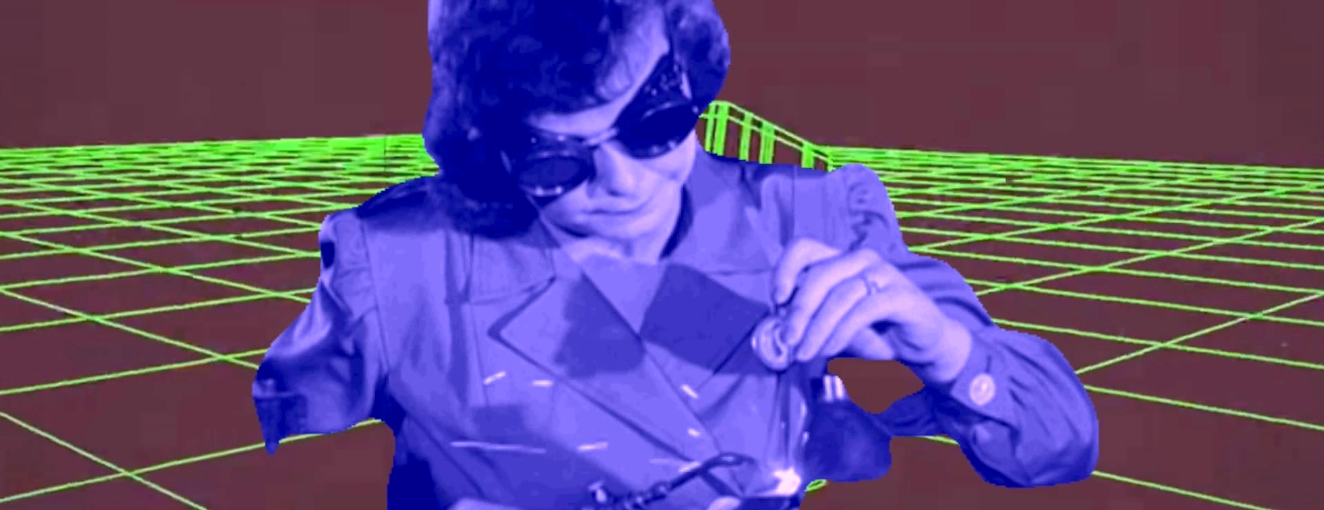 A women welding with some old-timey goggles sits in front of a Tron grid.